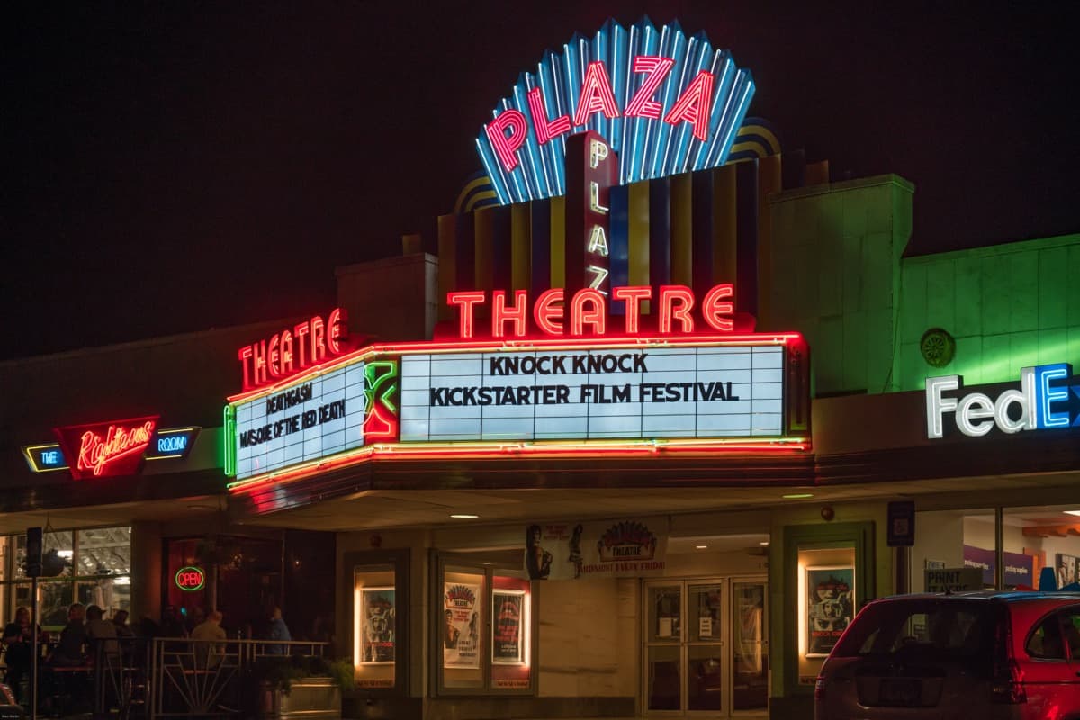 The Plaza Theatre's neon marquee at night